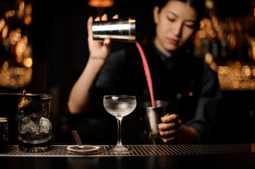 Two glasses on the metal bar counter