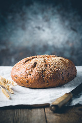 Fresh homemade crisp bread on wooden background. French bread. Bread at leaven. Unleavened bread