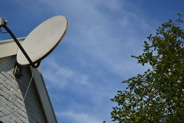 satellite dish on the roof and blue sky