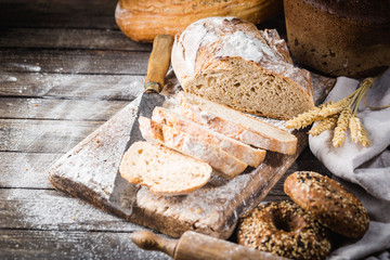 Fresh homemade slice bread and knife on rustic table