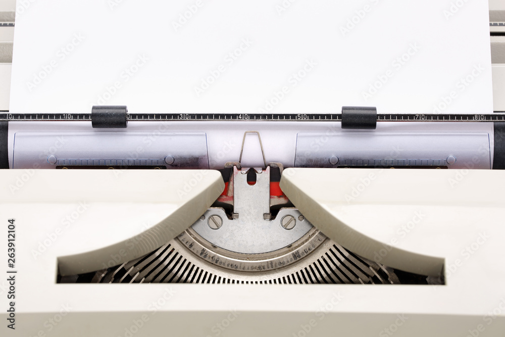 Fototapete close-up of a typewriter from the 70s with blank paper for text.