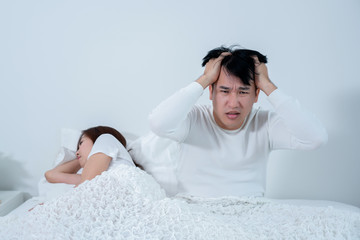 Asian men are sitting stressed about having sex with their wife. Which is caused by inefficiency...