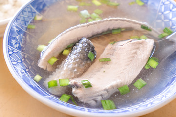Milkfish skin soup, distinctive Taiwan delicacy food in Tainan. Famous meal set for lunch or breakfast with vegetable, top view, copy space, close up
