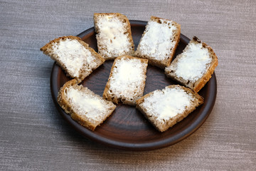 Small sandwiches on homemade bread with butter