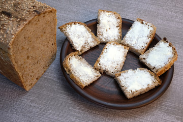 Small sandwiches on homemade bread with butter