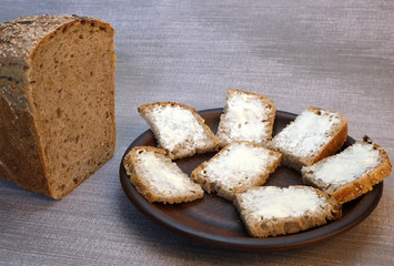 Small sandwiches on homemade bread with butter