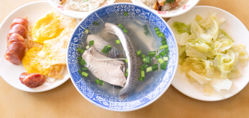 Milkfish skin soup, distinctive Taiwan delicacy food in Tainan. Famous meal set for lunch or breakfast with vegetable, top view, copy space, close up