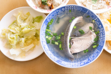 Milkfish skin soup, distinctive Taiwan delicacy food in Tainan. Famous meal set for lunch or breakfast with vegetable, top view, copy space, close up