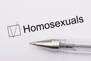 Homosexuals - checkbox with a cross on white paper with pen. Checklist concept.