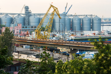 a granary in the port is a marine shipping port in the city of ODESSA, Ukraine. Cranes unloading and loading