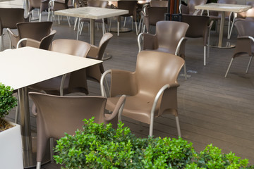 modern plastic gourmet chairs in an outdoor cafe