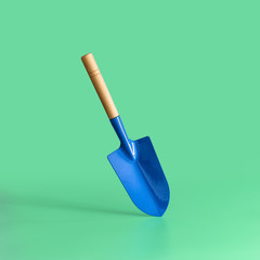 Garden tool. Blue blade on a green background