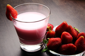 Fresh ripe juicy Strawberry with a glass of strawberry milkshake