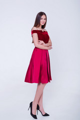 Beauty brunette model woman in evening dress. Beautiful fashion luxury makeup and hairstyle. Seductive girl silhouette on white background.