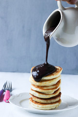 Stack of pancakes on a white background