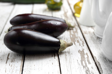 Eggplants, ripe vegetables on a wooden table.