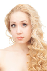 Fototapeta premium Portrait of a half-naked blonde on a white background.