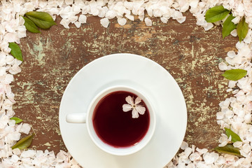 Cup of fruit tea and cherry blossom