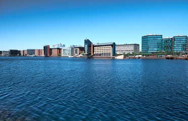 Obraz premium Modern buildings on the bank of the canal in Copenhagen, Denmark.