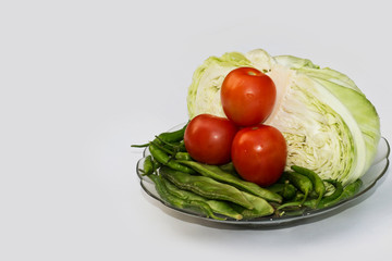 Close up on Fresh cabbage , beans, Green Chilli and Cherry tomato Organic vegetable background in freshness atmosphere