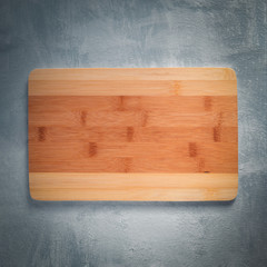 Bamboo cutting Board on grey background. Top view.
