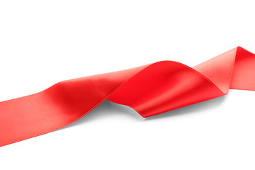 Simple red ribbon on white background. Festive decoration