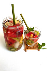 infused water in glass on white background