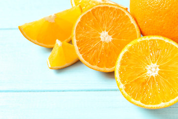Fresh oranges on wooden background, space for text