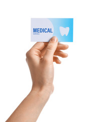 Woman holding business card isolated on white, closeup. Dental medical service