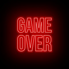 Neon game over green sign on dark background.