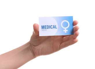 Girl holding medical business card isolated on white, closeup. Women's health service