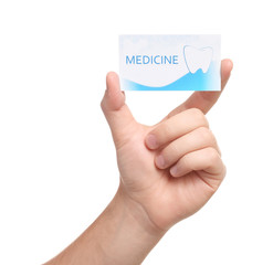 Man holding business card isolated on white, closeup. Dental medical service