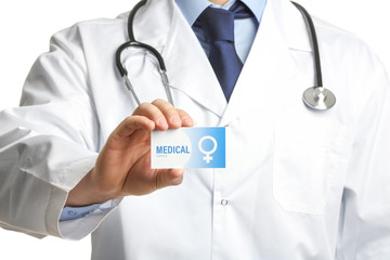 Gynecologist holding business card isolated on white, closeup. Medical service