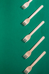 many plastic forks lying next to each other, copy space. art , creativity