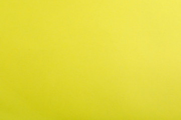 Abstract yellow background, top view. Colorful paper