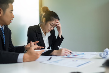 Feeling tired and stressed business woman with social network diagram in the office