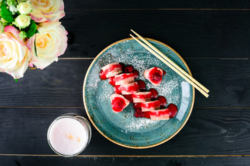 Dessert Maki Sushi - Roll with Various Fruit and Cream Cheese inside. Pancake outside. Served with Strawberries Sauce