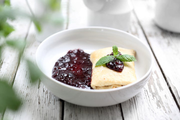 Pancake with white cheese and fruit marmalade.