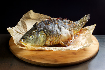 Carp stuffed with baked fruit, sewn with thread.