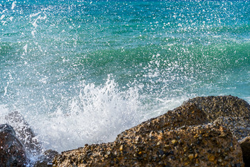 High wave splashing on the cliff