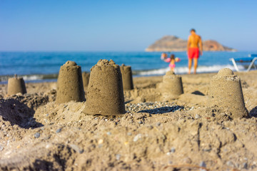 Fototapeta na wymiar Sand castle on the beach