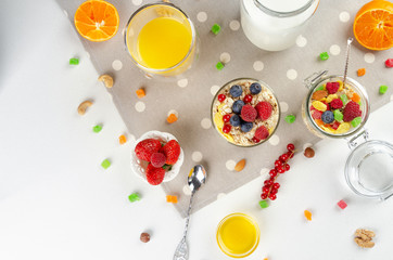 Obraz na płótnie Canvas Healthy breakfast with muesli, milk, yogurt, fruit