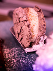 Dessert Chocolate sandwich cookie with ice cream and whipped cream