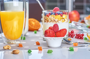 Healthy breakfast with muesli, milk, yogurt, fruit