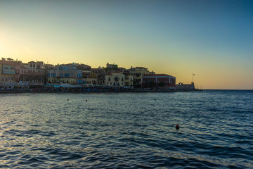 Fototapeta premium Greece, Chania, August 2018: illuminated venetian habour of Chania, Crete, Greece