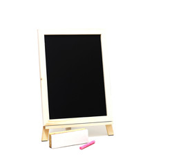 empty blackboard and colored chalks and brush removes the board on white background