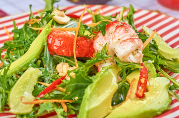 Fresh green salad with shrimps and poached egg