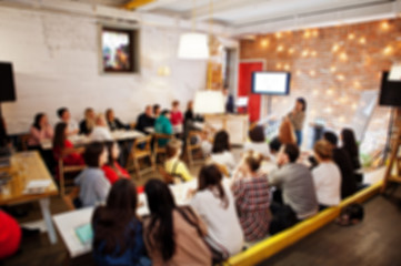 Master class and study concept. Abstract blurred photo of conference or seminar room with speaker...