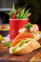 Delicious snacks with shrimp, fish and avocado