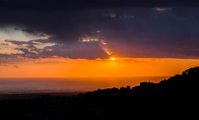 Fototapeta premium This is a capture of a sunset in Beirut and you can see the orange color formed by the sun and the beautiful horizon